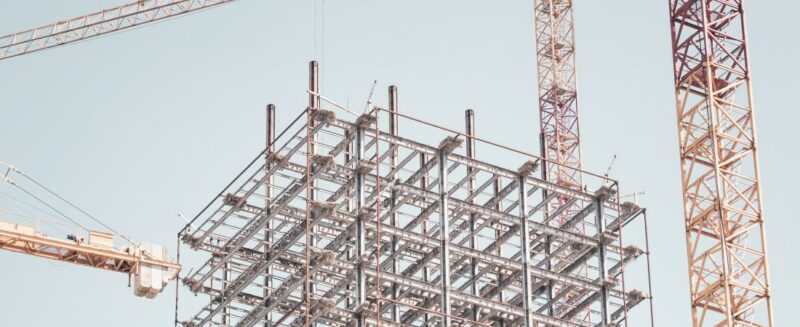 High Rise Construction Site with Cranes