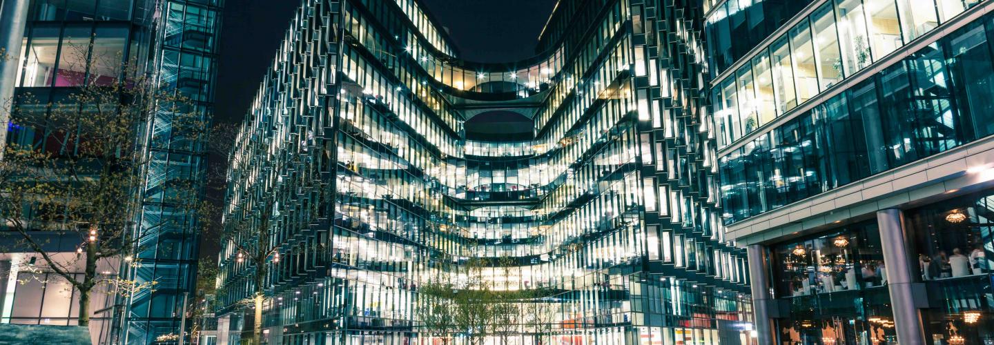 Modern architecture at night on riverbank in London